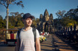 Man admiring monuments in ancient city. Portrait of tourist, Siem Reap, Cambodia..