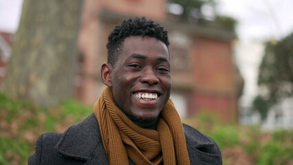 Happy black African man looking at camera smiling portrait during winter season3