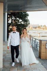 beautiful couple in love. stylish groom with the bride in a wedding dress