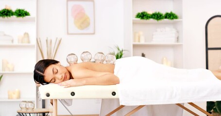 Sticker - Spa, cupping therapy and woman massage while relax on table for holistic body, muscle and pain care wellness in zen room. Sleeping, calm and healing asian or Japanese girl in glass physical therapy