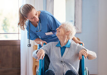 Nurse, Home And Elderly Woman With A Disability In A Wheelchair In Medical Nursing Facility. Happy, Healthcare And Doctor Helping And Talking To Disabled Senior Lady In Retirement House In Australia.