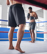 © Irshaad M/peopleimages.com - Boxing, fight or men kickboxing, ring and fitness training, workout or exercise in gym with gloves for battle. Strong boxer, fighting and action with athlete and competition with champion mindset