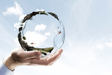 Canvas Print - Green sphere landscape with grass and clear water