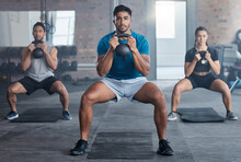 Fitness, Kettlebell And Personal Trainer With A Man Coach Training A Class In The Gym For Health. Exercise, Workout And Bodybuilder With A Male Athlete Teaching Students In A Club For Strong Muscles