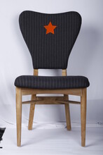 Wood Chair With Striped Black Cushion And Red Star Design