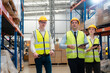 © 2B - Warehouse team discussing while walking in warehouse