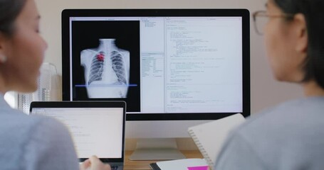 Big data AI coding screen for asian future health care smart tech IT solution. Asia team woman people code analyst job work on science project Lung X-ray scanner medtech tools meeting talk at office.