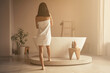 © Damir Khabirov - Rare view of attractive slim woman in towel going to take bath in white ceramic bathtub