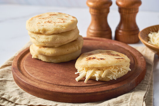 arepa made from ground corn dough, cornmeal, traditional in the cuisine of colombia and venezuela wi