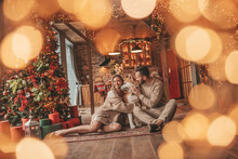 Candid Authentic Happy Married Couple Spends Time Together With Japanese Dog At Xmas Lodge