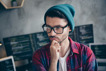 Photo of confident minded programmer wear spectacles hand arm chin creating new start up indoors workplace workshop home