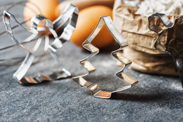 Poster - Bakery background. Metal shapes for christmas cookies close-up with copy space