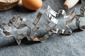 Poster - Set various metal shapes for cooking homemade christmas cookies close-up. Bakery background