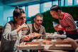 © .shock - Eating pizza with diverse colleagues in the office, happy multi-ethnic employees having fun together during lunch, enjoying good conversation, and emotions
