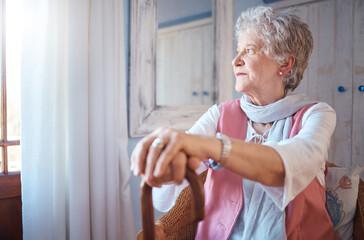 Senior woman, cane and thinking in home, nostalgic or contemplating old memory. Disability, support and retired female with walking stick relaxing, focus or lost in thoughts alone in lonely house.