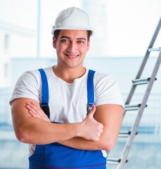 Wall Mural - Young worker with safety helmet hardhat