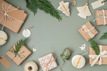 Christmas Background With Gift Boxes And Kraft Wrapping Paper. Xmas Celebration, Preparation For Winter Holidays. Festive Mockup, Top View, Flatlay
