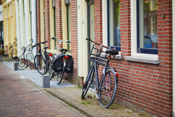 Wall Mural - Bicycles near red brick wall in Alkmaar, Netherlands