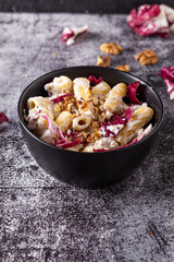 Poster - Creamy pasta with ricotta, walnuts and radish. Vegetarian macaroni pasta with ricotta and radicchio.