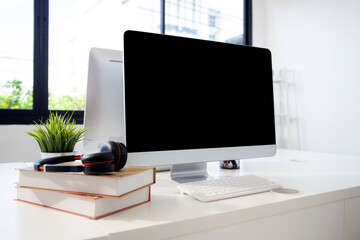 Wall Mural - desktop computer mockup on desk at home office, mock up display screen blank for template minimal st