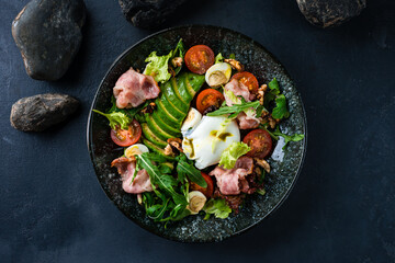 Poster - Salad of avocado, poached eggs, bacon, quail eggs, tomatoes, arugula and lettuce.