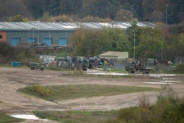 Wall Mural - convoy of British army Heavy Utility Trucks returning to a base