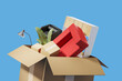 © ImageFlow - Furniture falling into a carton box, company relocation