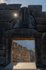 Sticker - view of the Lion Gate entrance portal at the ancient citadel of Mycenae with a morning sunburst