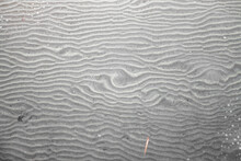 Texture Created In The Sand Of The Beach, Covered By The Puddled Water, Calm And Shallow At Low Tide.