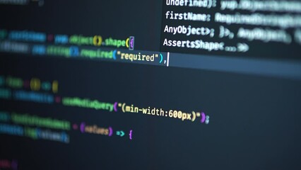 developer is browsing html code on the computer screen. html web page code scrolling programming cod