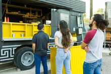 Customers Queuing To Make Their Food Order At The Food Truck