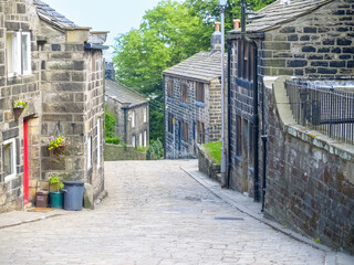 Sticker - Small English traditional village road leading downhill