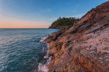 Wall Mural - Sea rocks at tropical sunset.