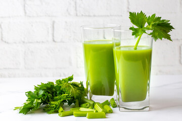 A glass of green celery juice. Celery drink prepared for healthy nutrition and detox.