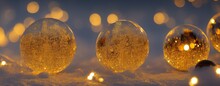 Clear Glass Marbles In Snow Macro Shot, Amber Light With Bokeh Background, Sparkly