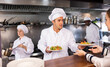 © JackF - Service process in cafe - chef serves ready meals to visitors of restaurant