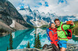 © Maridav - Moraine lake Couple tourists taking selfie picture on Canada travel hike using phone. Young hikers happy using phone on Banff holiday