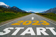 Leinwandbild Motiv 2023 New Year road trip travel and future vision concept . Nature landscape with highway road leading forward to happy new year celebration in the beginning of 2023 for fresh and successful start .