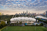 Fototapeta  - Melbourne Australia May 15th 2020 : Aerial panoramic dawn view of AAMI stadium, with the Melbourne city in the background