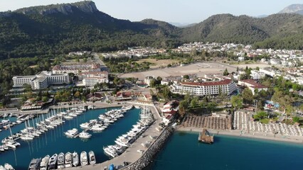 Wall Mural - Drone view of Kemer, resort town on Mediterranean coast of Turkey. City of Antalya, on Turkish Riviera.