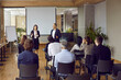© Studio Romantic - Diverse businesspeople present business project to employees at seminar in office. Presenters or speakers lead meeting with workers in boardroom, have team conference. Training concept.