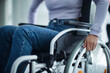 © Halfpoint - Close-up of young woman at wheelchair in hospital.