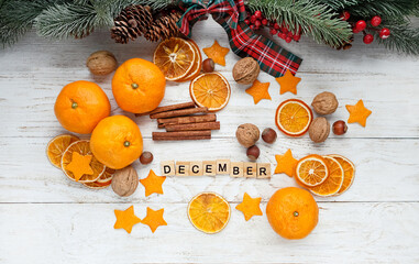 Wall Mural - Christmas background. tangerines, dried orange slices, nuts, cinnamon, festive decor and letter 