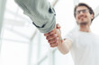 © yurolaitsalbert - close up. young entrepreneur shaking hands with his business partner
