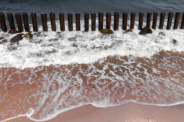 Shore water and wooden breakwater structure, Baltic Sea