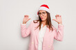 © Asier - Business caucasian woman wearing a christmas hat isolated on white background feels proud and self confident, example to follow.