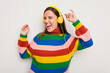 © Asier - Young caucasian woman listening to music with headphones isolated on white background