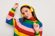 © Asier - Young caucasian woman listening to music with headphones isolated on white background