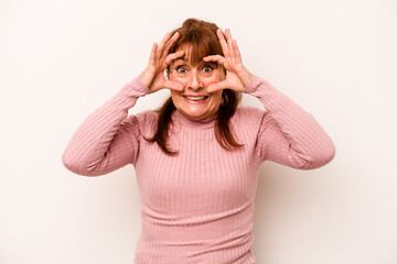 Wall Mural - Middle age caucasian woman isolated on white background keeping eyes opened to find a success opportunity.