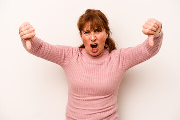 Wall Mural - Middle age caucasian woman isolated on white background showing thumb down and expressing dislike.